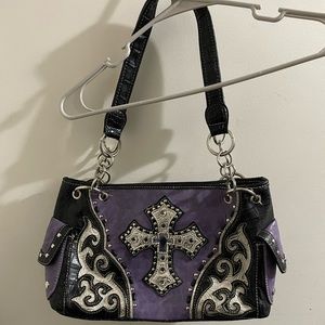 Woman’s purse purple in color. Bought at a rodeo show.